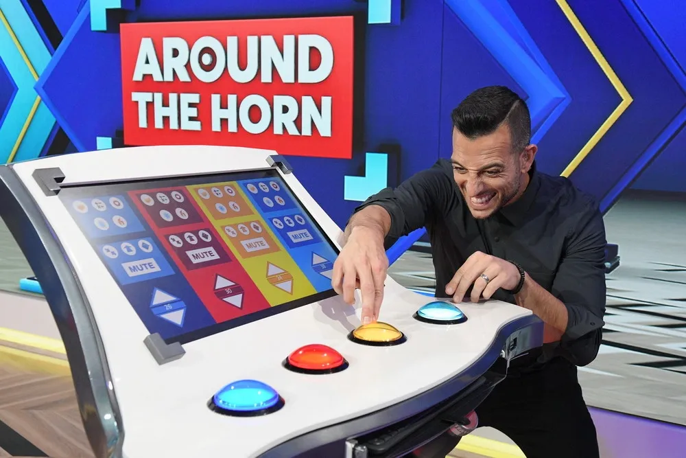 Tony Reali at the Around the Horn mute button console